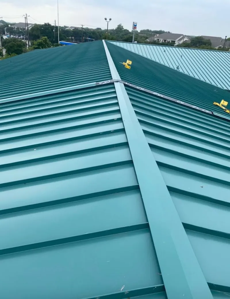 Green commercial metal roof ridge and valley for Metal Roof Repair in Baxter Village