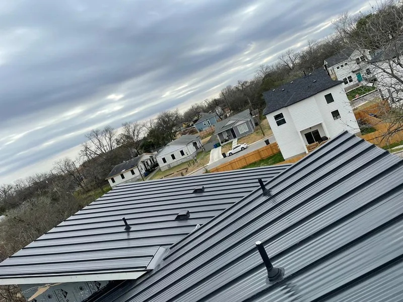 Standing seam metal roof panels with vents for Skylight Repair in Baxter Village